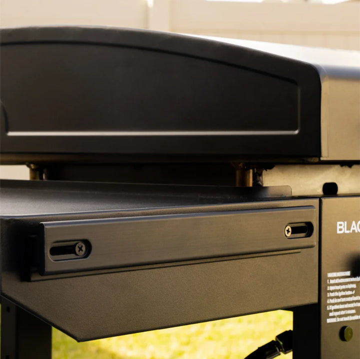 Blackstone Original 28-Inch Griddle with Hood featuring Omnivore technology for even heat distribution and wind protection, with two independently controlled heat zones and reinforced hood.