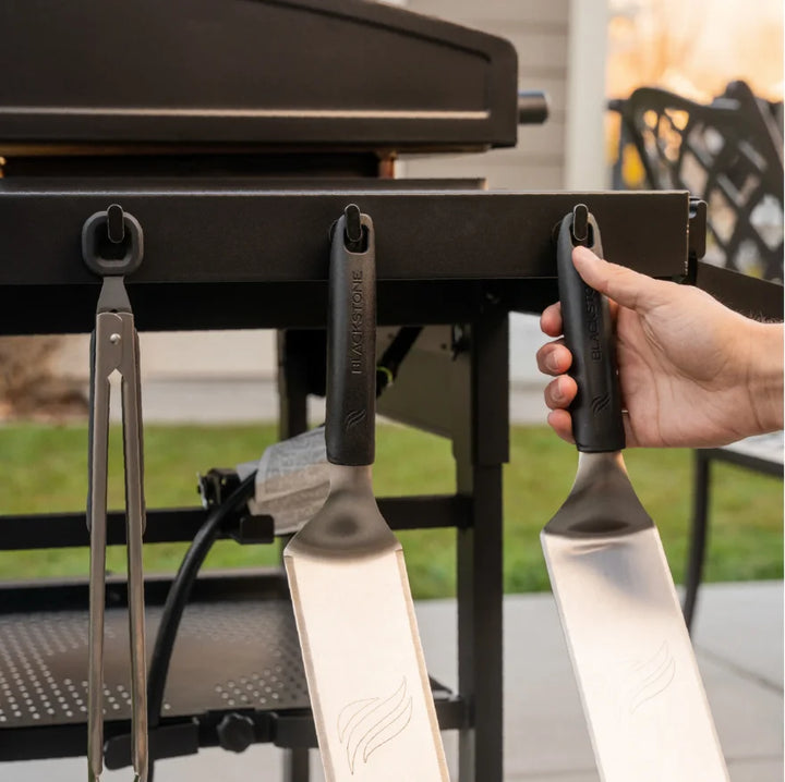 Blackstone Original 28-Inch Griddle with Hood features Omnivore Griddle Plate Technology for even heat distribution and wind protection, with dual independently controlled heat zones, reinforced hood, and smart storage solutions.