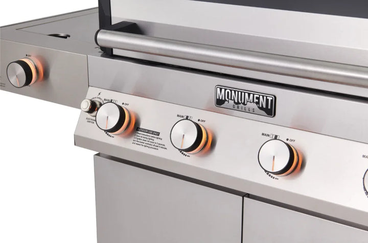 Monument Grills Denali Series D405 Stainless Steel 4-Burner Gas Grill with Digital Touchscreen, Color-Changing LED Knobs, ClearView Lid and Bluetooth Connectivity.
