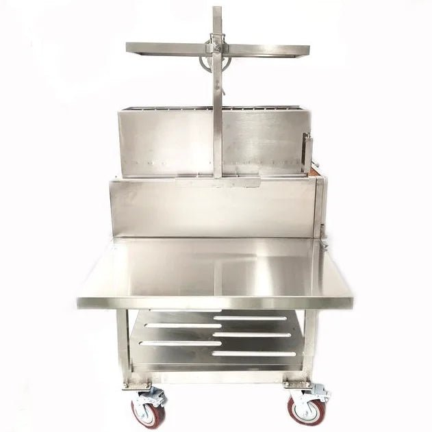 Tagwood Santa Maria Style Wood Grill features stainless steel construction with height-adjustable main grate, secondary grate, and interchangeable griddle for versatile open-fire cooking experience with 1,117 sq. in. of grilling area.