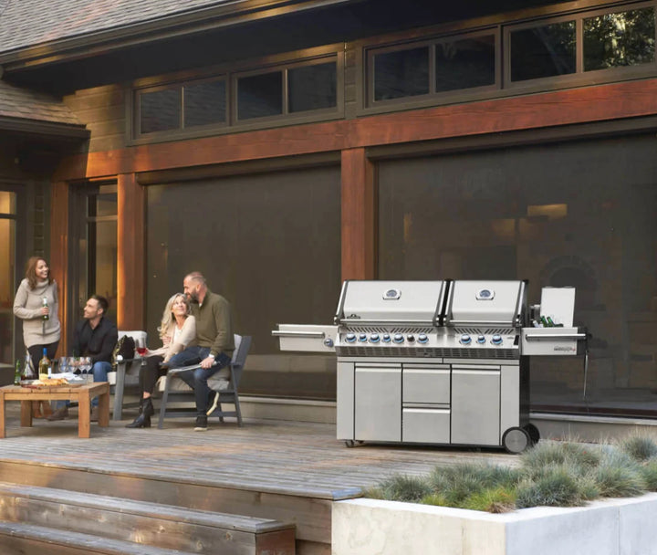Napoleon Prestige Pro 825 RSBI propane grill with two independent heads, powerful side burner, infrared rear and bottom burners, stainless steel body, and LED NIGHT LIGHT Control Knobs for customizable color options.