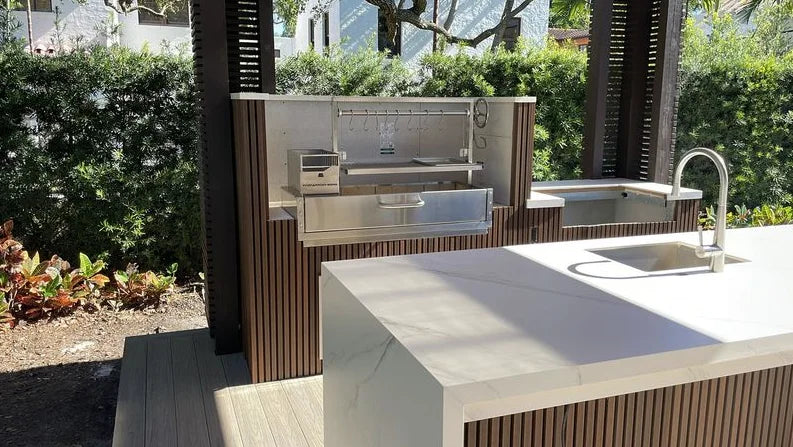 Tagwood Built-In Santa Maria Style Grill (BBQ05SS) features #304 stainless steel construction, adjustable main grate, interchangeable griddle, S-shape meat hooks, and gaucho-style brasero firebox with front door.