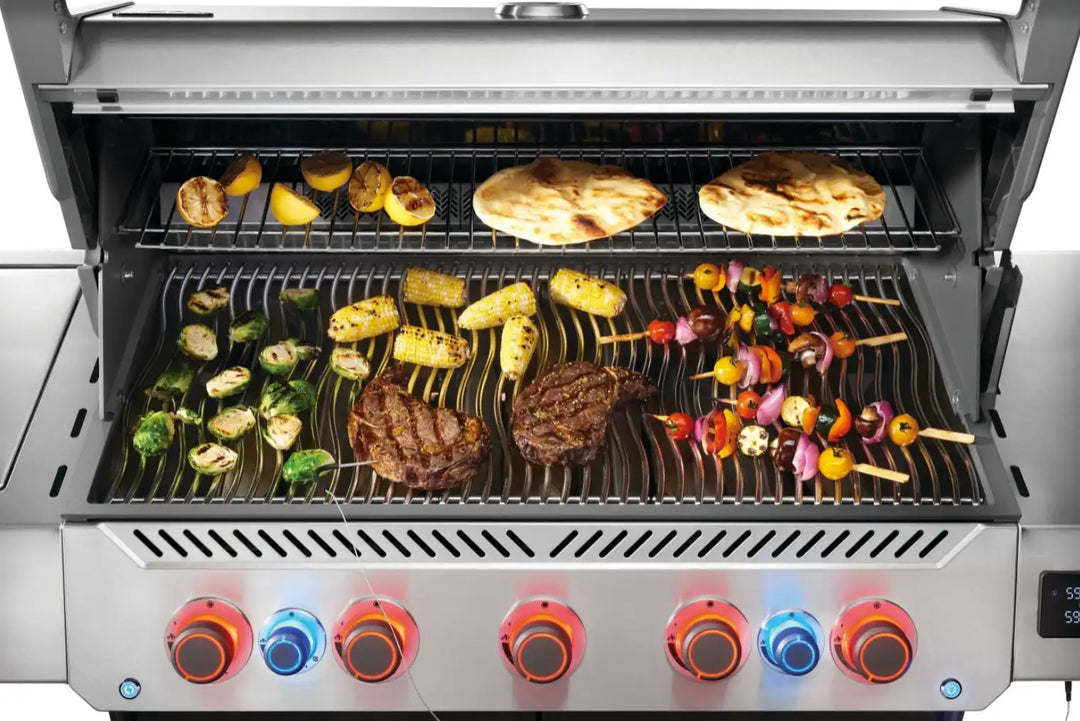 Napoleon Prestige 665 Series Gas Grill: high-performance outdoor grill built from durable stainless steel with elegant chrome accents, featuring seven burners, infrared rear rotisserie burner, and large SIZZLE ZONE side burner, ideal for everyday meals and large gatherings.