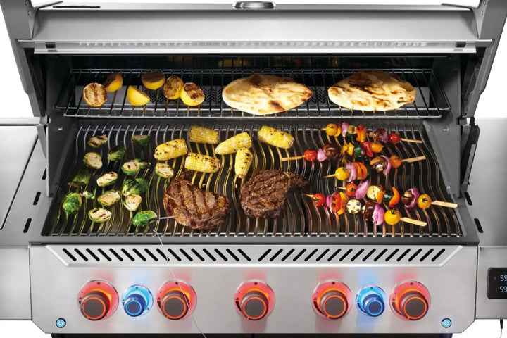 Napoleon Prestige 665 Series Gas Grill: high-performance outdoor grill built from durable stainless steel with elegant chrome accents, featuring seven burners, infrared rear rotisserie burner, and large SIZZLE ZONE side burner, ideal for everyday meals and large gatherings.