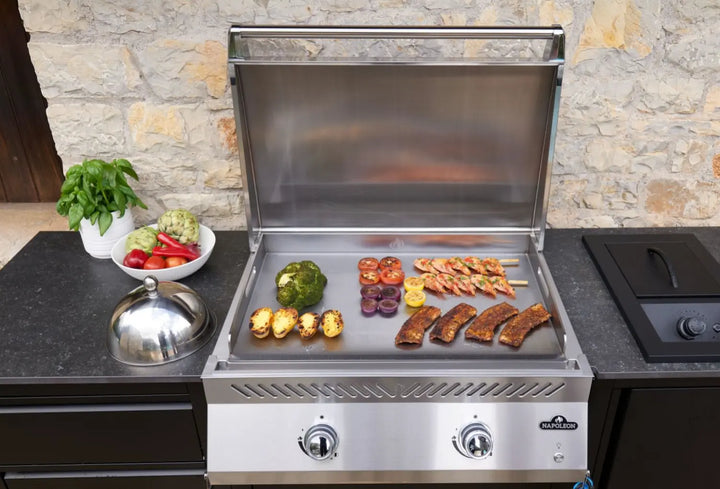 Napoleon Built-In 700 Series 32 Griddle featuring premium 304 stainless steel construction and dual U-shaped burners delivering 24,000 BTUs for versatile two-zone cooking.