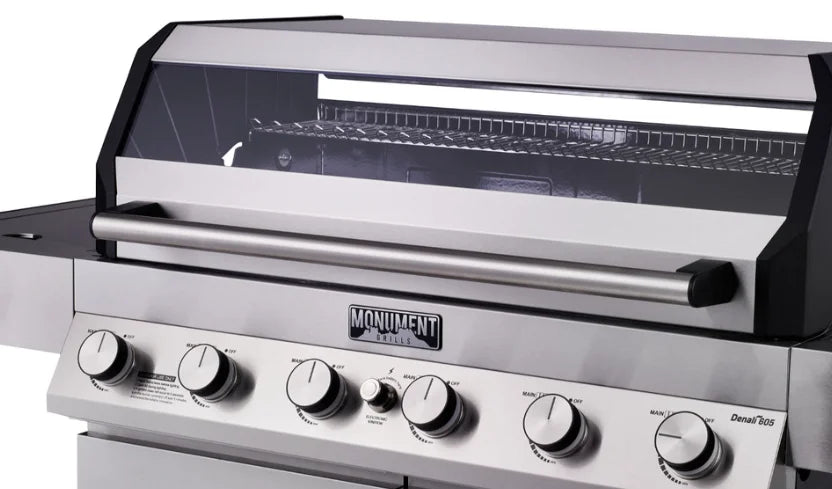 Monument Grills Denali Series D605 Gas Grill - Stainless Steel Construction, Six High-Output Burners, ClearView Lid, Digital Touchscreen Interface, and Bluetooth Connectivity for Wireless Monitoring and Control.