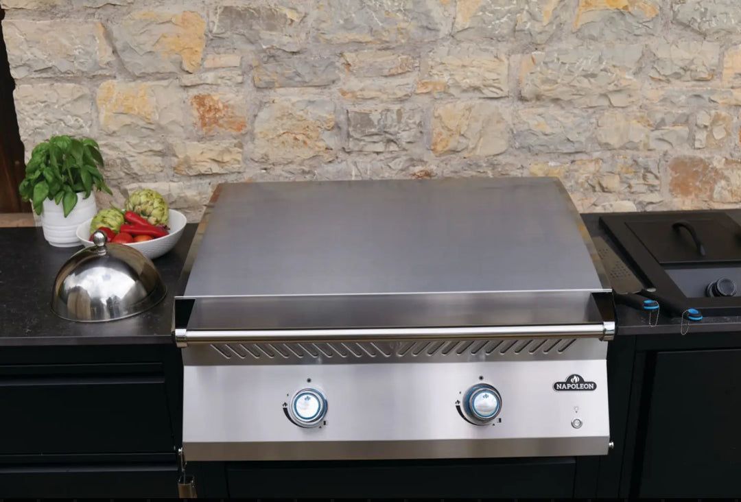 Napoleon Built-In 700 Series 32 Griddle: High-performance cooking griddle with premium 304 stainless steel body, 5mm thick 430 stainless steel cooktop, and dual U-shaped burners delivering 24,000 BTUs across 500 sq.in. of total cooking area.