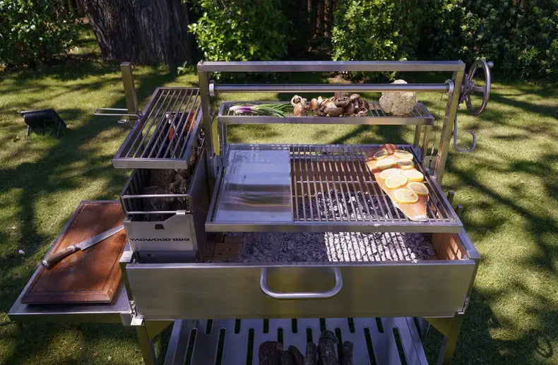 Tagwood Santa Maria Style Wood Grill features #304 stainless steel construction, adjustable grates, S-shaped hooks, and integrated brasero firebox for authentic gaucho cooking.