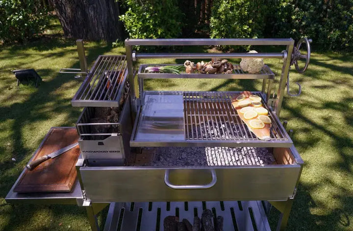 Tagwood Santa Maria Style Wood Grill features #304 stainless steel construction, adjustable grates, S-shaped hooks, and integrated brasero firebox for authentic gaucho cooking.