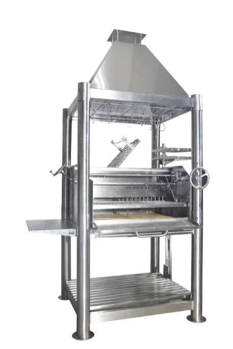 Tagwood's The Silver Bullet Santa Maria Style Grill - Stainless Steel features 6 cooking surfaces, built-in firebox, and height-adjustable grates for precision temperature control in a rugged 304 stainless steel construction.