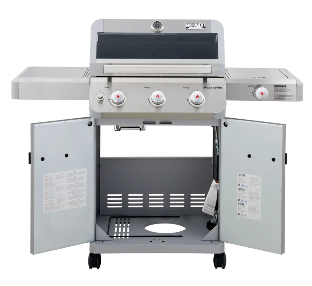 Monument Grills Mesa Series M305 Gas Grill stainless steel propane grill featuring three high-performance burners delivering 45,000 BTUs of consistent heat and porcelain-coated cast iron grates for perfect sear marks.