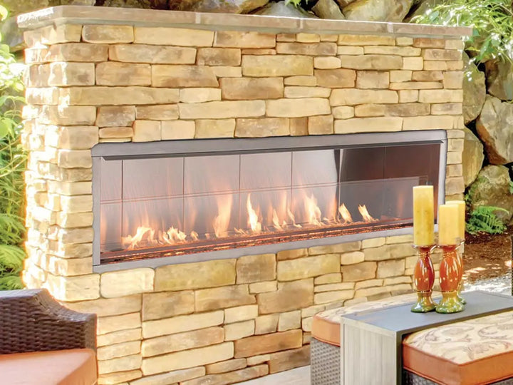 Superior Outdoor Vent-Free Gas Fireplace - VRE4600 Series in 36-72" linear configurations, featuring stunning flames dancing across crushed glass, enhanced by full-spectrum LED lighting and weather-resistant stainless steel construction.