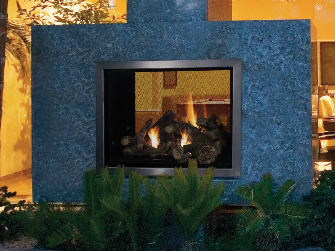 Superior 40" See-Through Direct Vent Gas Fireplace features a sleek flush hearth design with expansive ceramic glass viewing area and powerful flames over an aged oak log set.