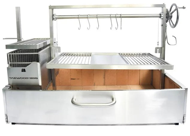 Tagwood XL Built-In Santa Maria Style Grill, stainless steel construction, extra-large grilling area, 1,103 sq. in., firebrick insulation rated above 1500 °C, height-adjustable main grate and secondary grate over the firebox, S-shape meat hooks, round stainless steel grates for optimal searing and easy cleanup.