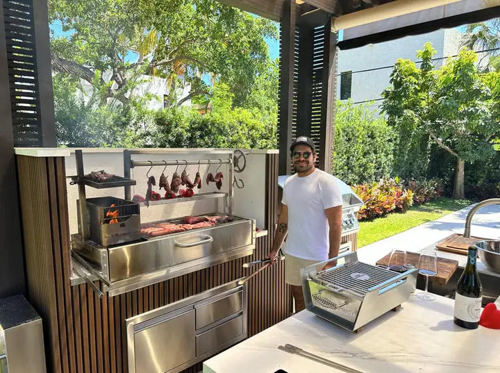 Tagwood Built-In Santa Maria Style Grill (BBQ05SS) featuring #304 stainless steel construction, height-adjustable main grate, interchangeable griddle, and S-shape meat hooks for versatile cooking zones.