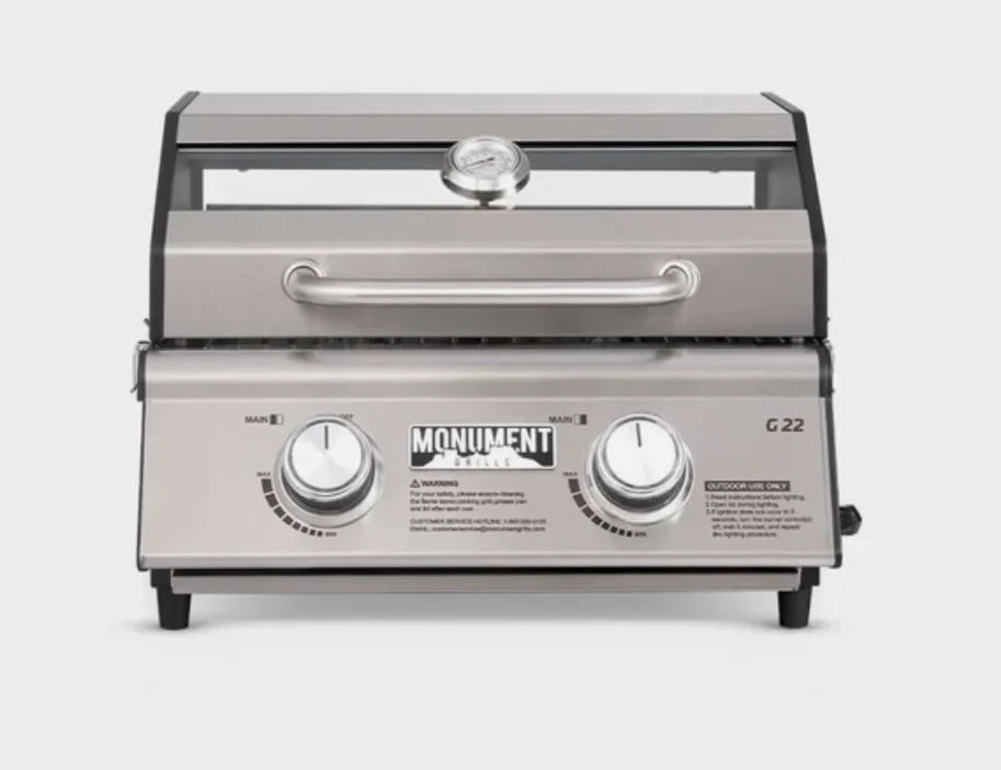 Monument Grills G22 Tabletop Gas Grill: A compact stainless steel grill perfect for patios, balconies, RV setups, or campsite tables, delivering 15,000 BTUs of heat across two powerful burners with even heat distribution and 207 sq. in. of cooking space.