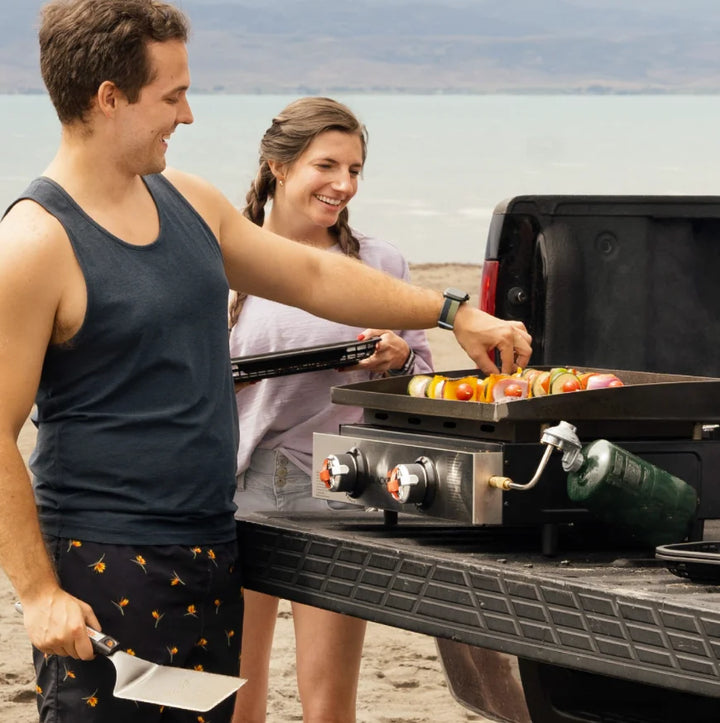 Blackstone Original 22-inch Tabletop Griddle featuring Omnivore Griddle Plate for even heat distribution, dual burners, and rear grease management system.