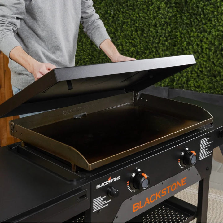 Blackstone Original 28-Inch Griddle with Hard Cover features a 28" Omnivore Griddle Plate for efficient heat distribution and a durable hard cover for protection from the elements.