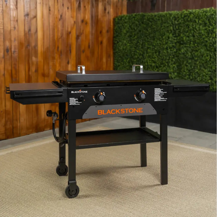 Blackstone Original 28-Inch Griddle with Hard Cover: Outdoor gas griddle featuring an Omnivore griddle plate for efficient heat distribution, dual heat zones, and electric push-button ignition.