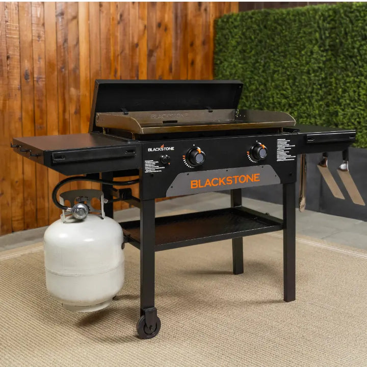 Blackstone Original 28-Inch Griddle with Hard Cover features Omnivore Griddle Plate for efficient cooking, dual heat zones, side shelves, and grease management system, ideal for large gatherings.