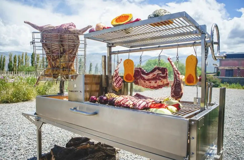 Tagwood XL Freestanding Argentine Santa Maria Style Grill - Stainless steel cooking station featuring five distinct grilling areas, adjustable grate, brasero firebox, and integrated tools for high-performance open-fire cooking.