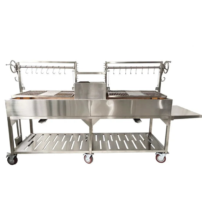 Tagwood XL Santa Maria Style Grill - Stainless Steel features two massive grilling surfaces, dual fireboxes, height-adjustable grates, interchangeable griddle, meat hooks, and foldable side table for unmatched versatility in open-fire cooking.