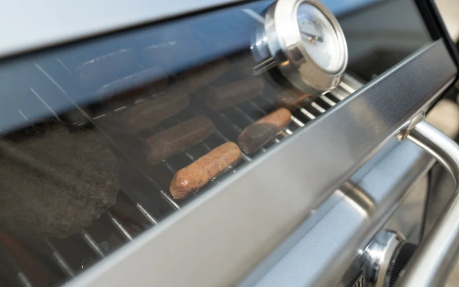 Monument Grills G22 Tabletop Propane Gas Grill, compact stainless-steel grill for small spaces, delivering 15,000 BTUs of heat across two powerful burners and 207 sq. in. cooking surface.