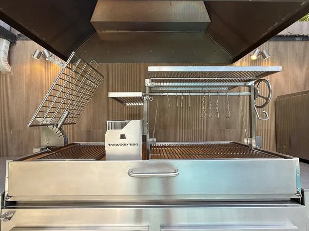 Tagwood 2XL Built-In Santa Maria Style Grill features premium 304 stainless steel construction, five distinct cooking zones, including clamp grill, griddle, roofing grill, and secondary grate, for over 2,600 sq. in. of total grilling space with precise heat control through the Santa Maria elevation system.