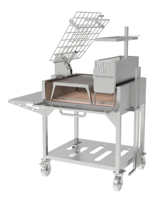 Tagwood Santa Maria Style Clamp Grill with Firebox (#304 Stainless Steel Construction) featuring rotating clamp grill, fixed grill box, secondary grate, firebrick-lined walls, and integrated firebox ("brasero") for authentic Argentine-style roasting.