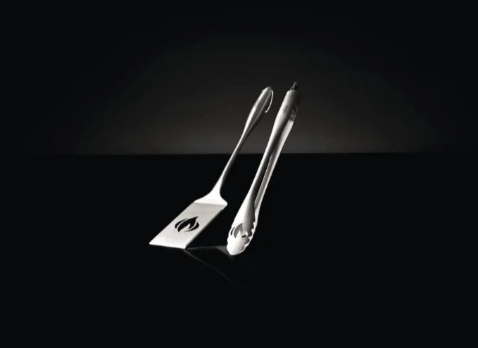 Napoleon PRO Stainless Steel 2-Piece Toolset featuring premium locking tongs with slide-lock mechanism and ergonomic grip, paired with a large multifunctional spatula boasting an extra-long face and serrated edge.