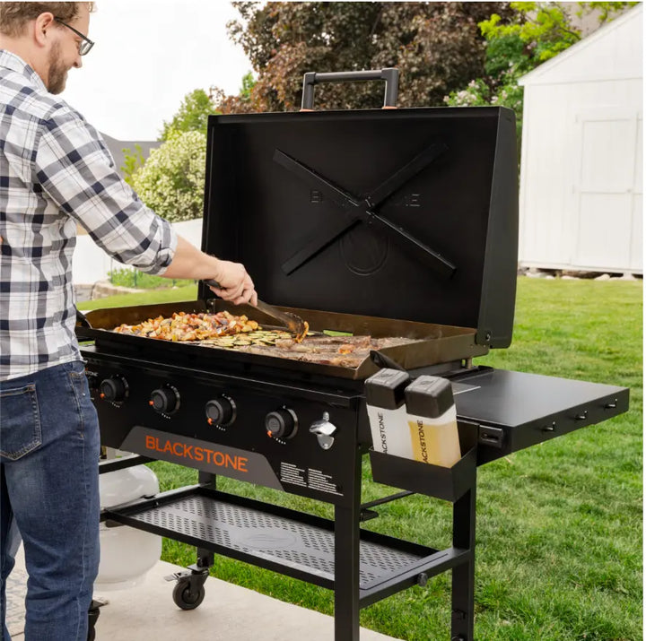Blackstone Original 36-Inch Griddle with Hood features Omnivore Griddle Plate Technology for faster preheating and improved fuel efficiency, with four independently controlled heat zones and reinforced hood for consistent performance.
