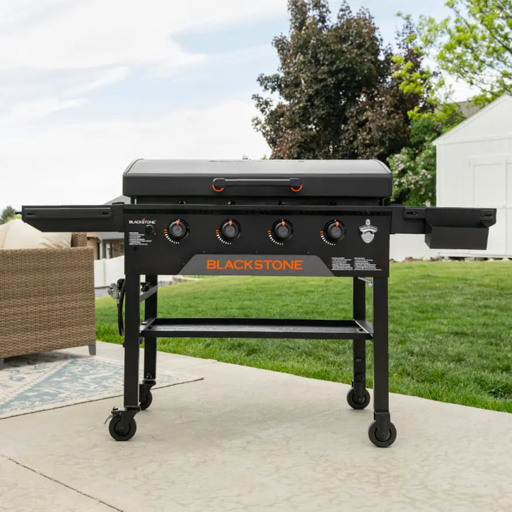 Blackstone Original 36-Inch Griddle with Hood featuring Omnivore Griddle Plate Technology for even heat distribution and improved fuel efficiency, complete with reinforced hood, four independently controlled heat zones, and integrated convenience features.