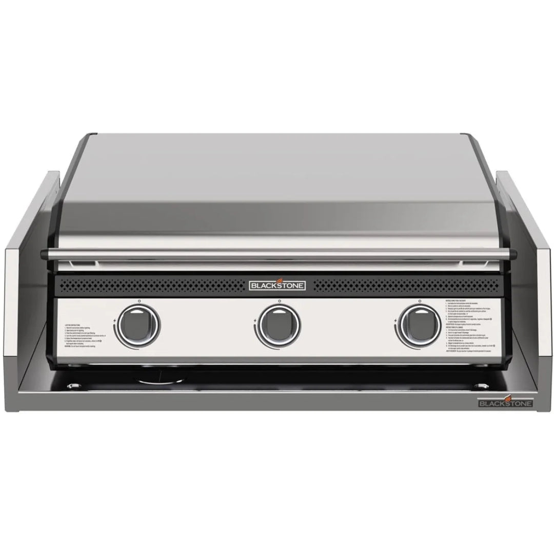 Blackstone 28” Deep Drop-In Griddle with Hood and Insulating Jacket: High-performance outdoor griddle featuring 304-grade stainless steel construction, Omnivore Griddle Plate for rapid heating, three independently controlled heat zones, ambient lighting, built-in hood, and rear grease management system.