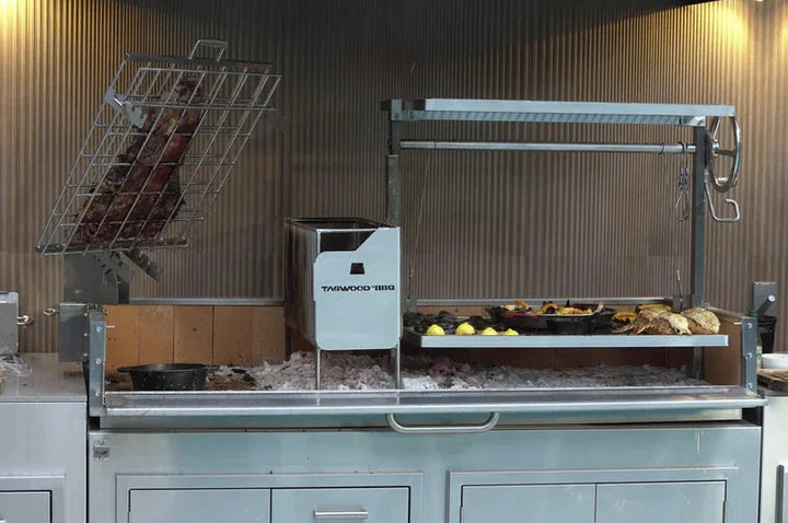 Tagwood 2XL Built-In Santa Maria Style Grill featuring premium 304 stainless steel construction, five distinct cooking zones, and over 2,600 sq. in. of grilling space.