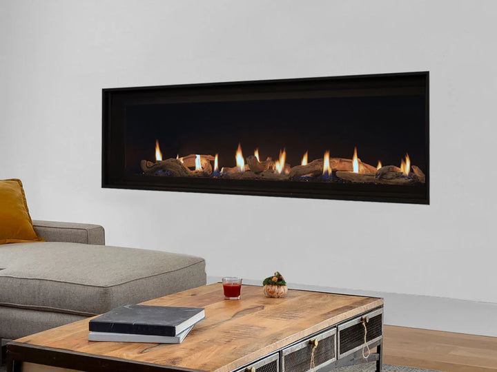 Superior DRL4000 Series Linear Direct Vent Gas Fireplace in sleek modern design with expansive ceramic glass viewing area, reflective black crushed glass media, and electronic ignition.