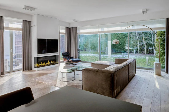 Modern Flames Orion Multi Electric Fireplace in use, featuring Heliovision Flame Technology with realistic wood, gas, and hybrid flame patterns, along with customizable colors and crackling sound effects, sitting on a built-in or wall-mounted installation with Reflective Black Glass media and Western Driftwood logs.