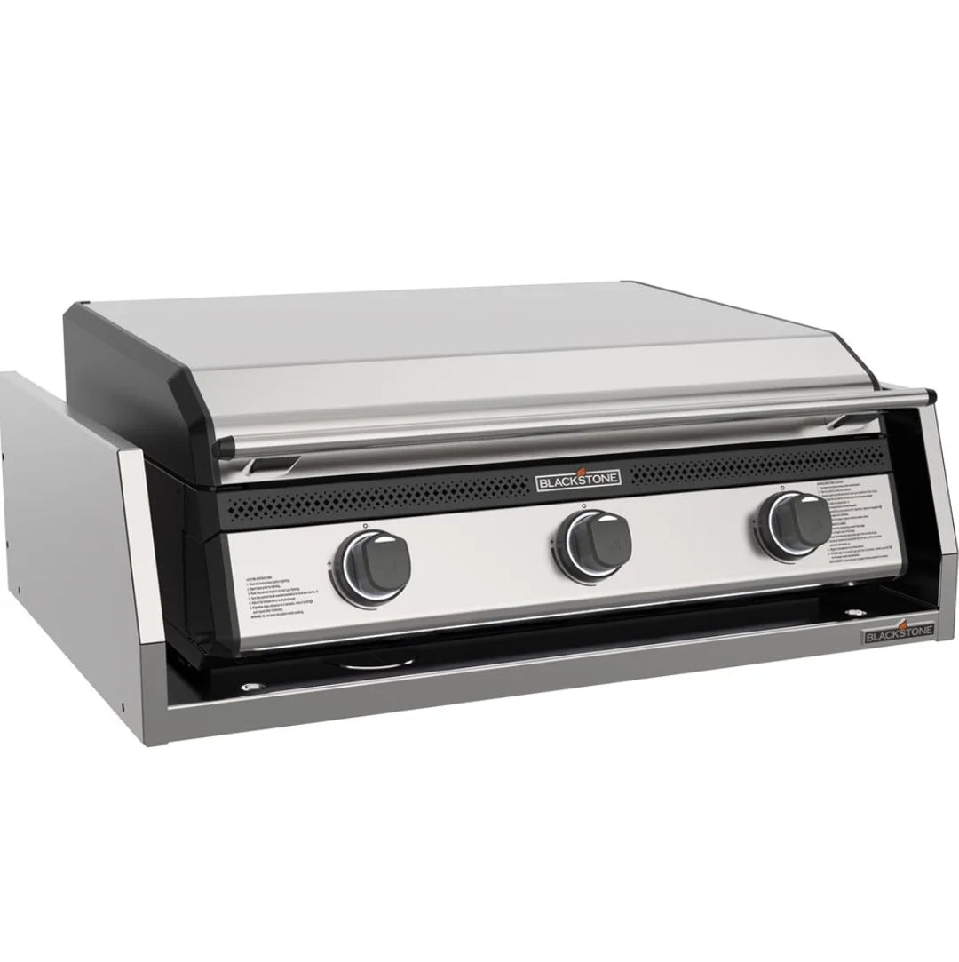 Blackstone 28" Deep Drop-In Griddle with Hood and Insulated Jacket: A premium outdoor griddle featuring 304-grade stainless steel construction, Omnivore Griddle Plate for even heat distribution, and three independently controlled U-shaped burners for multi-zone cooking.