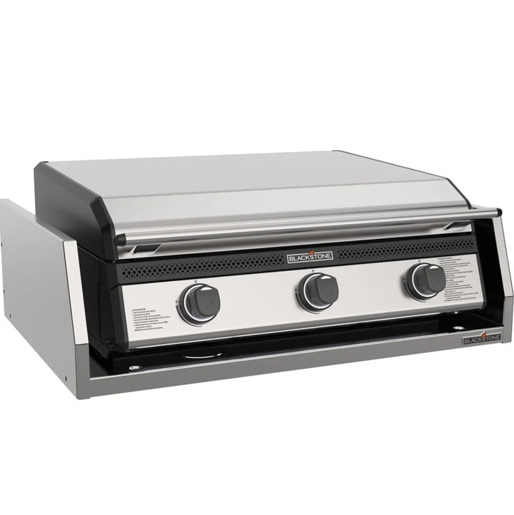 Blackstone 28" Deep Drop-In Griddle with Hood and Insulated Jacket: A premium outdoor griddle featuring 304-grade stainless steel construction, Omnivore Griddle Plate for even heat distribution, and three independently controlled U-shaped burners for multi-zone cooking.