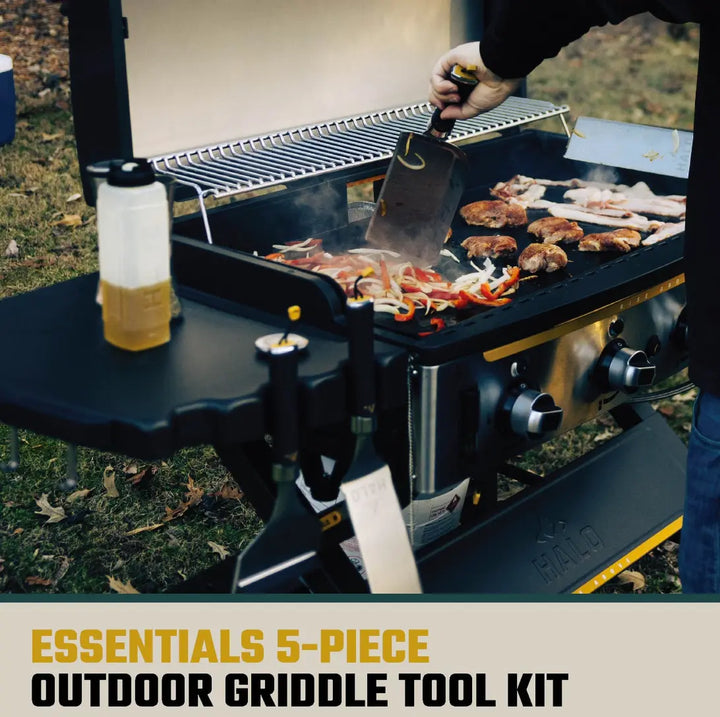 HALO 5-Piece Elite Essentials Griddle Tool Kit featuring stainless steel spatula, scoop spatula, blade spatula, squeegee scraper, and 27 oz squeeze bottle with magnetic handles for griddles.