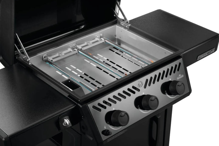 Napoleon 24" Freestyle Non-Stick Griddle features pre-seasoned steel cooktop, 3 burners delivering 25,200 BTUs of heat, and folding side shelves for outdoor cooking convenience.