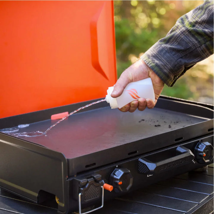 Blackstone OTG Camping Toolkit includes spatulas, scraper, tongs, and squeeze bottles for cooking, flipping, serving, and cleanup on-the-go.