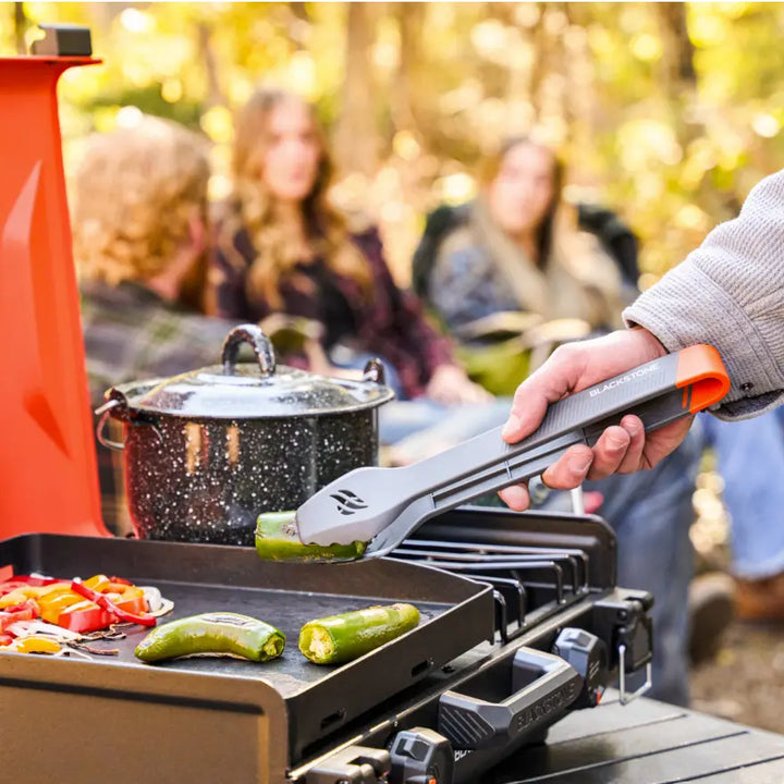 Blackstone OTG Camping Toolkit, all-in-one camping accessory kit featuring coated-surface compatible spatulas, scraper, tongs, and squeeze bottles for easy on-the-go cooking and cleanup.