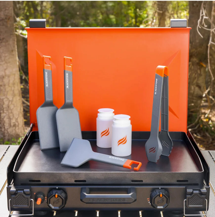 Blackstone OTG Camping Toolkit includes 2 spatulas, 1 scraper, 1 set of tongs, and 2 8 oz squeeze bottles for safe use on Blackstone griddles with coated surfaces, ideal for camping and outdoor cooking.
