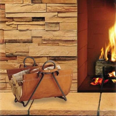 Pilgrim Forged Iron Log Carrier features hand-forged iron frame in Vintage Iron finish paired with genuine suede leather log carrier for elegant and functional hearth display.