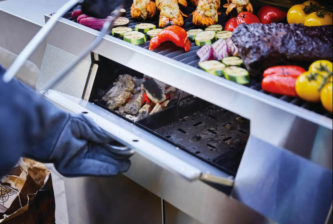 Napoleon Professional 605 Charcoal Cart, stainless steel construction, large cooking area, adjustable charcoal bed, sliding air vents, rear rotisserie burner, WAVE™ cooking grids for sear marks, easy cleanup with slide-out ash tray.