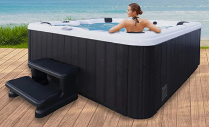 American Spas 6-Person Bench Spa features ergonomic bench seating and 45 strategically placed stainless steel jets for targeted hydrotherapy massage, Bluetooth stereo system, multi-colored LED lighting, and energy-efficient heating systems.