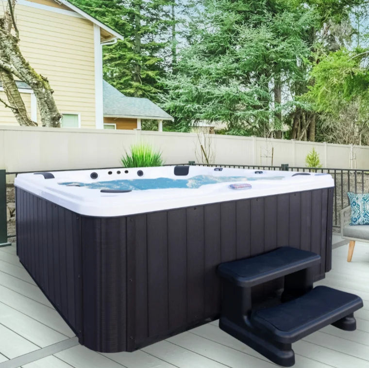 American Spas 6-Person Bench Spa features glossy white acrylic shell, 56 Halo stainless steel jets, Bluetooth sound system, and LED HydroStreamers for immersive hydrotherapy experience.