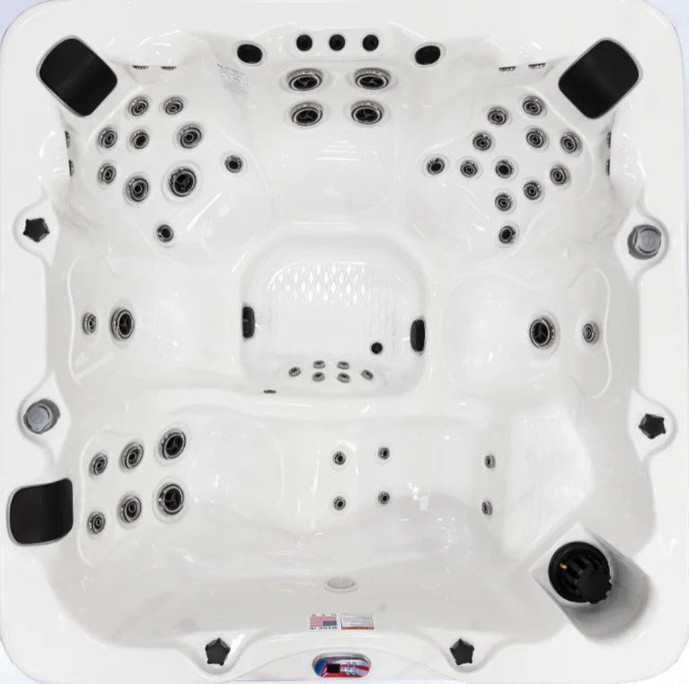 American Spas 6-Person Lounger with 56 Jets: Luxurious outdoor spa for up to six people featuring 56 exclusive Halo stainless steel jets, Bluetooth stereo system, and premium acrylic construction for ultimate relaxation and sensory immersion.