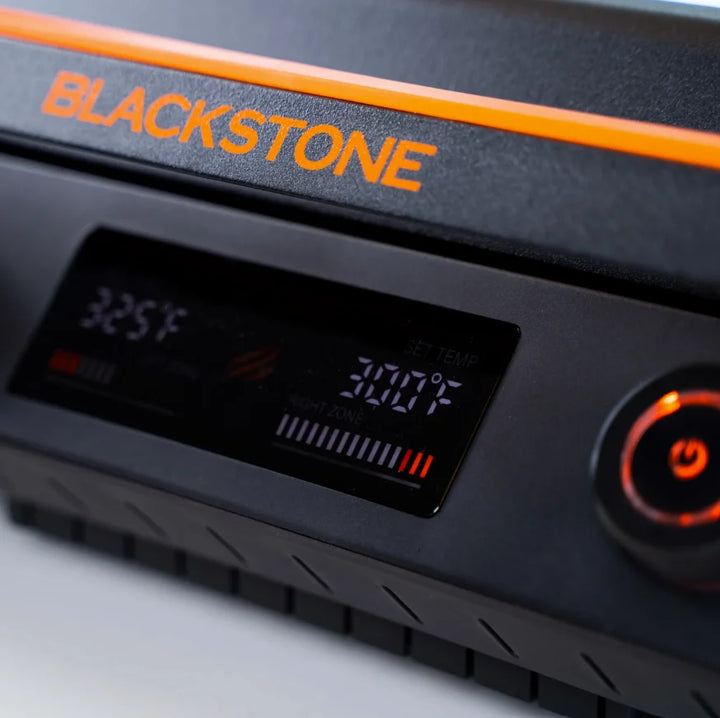 Blackstone E-Series 22" Electric Tabletop Griddle features a ceramic titanium-coated cooking surface, dual heat zones, and removable hood for versatile teppanyaki-style cooking indoors or outdoors.