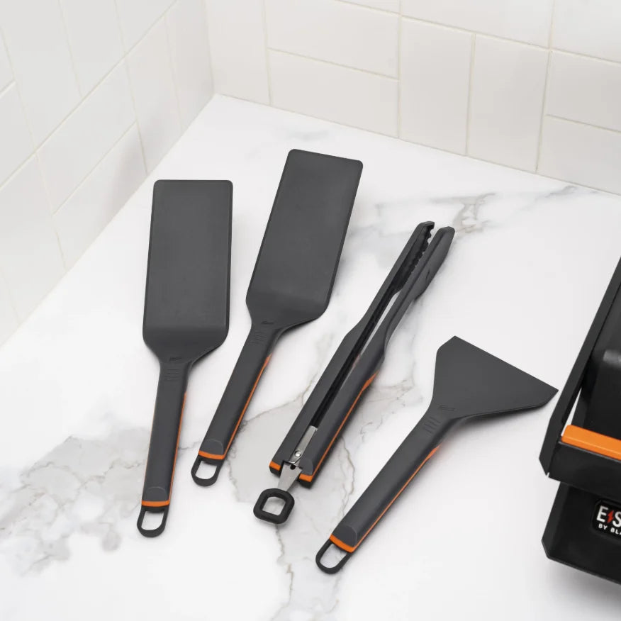 Blackstone E-Series Griddle Accessories Kit (4 Pieces): A comprehensive 4-piece toolkit designed for coated E-Series griddles, featuring two heat-resistant nylon spatulas, one scraper, and one set of tongs for effortless cooking and cleanup.